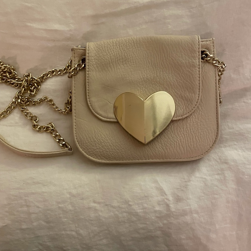 White purse with gold heart